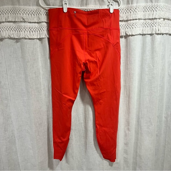 Athleta x Peloton Velocity 7/8 Orange Leggings with Zipper Pouch - Picture 5 of 11